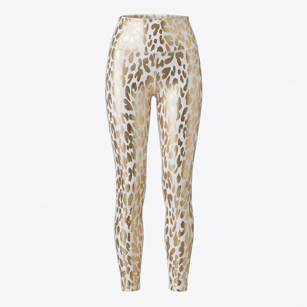 A pair of high-waist leopard print leggings in gold and white, paired with white sneakers.